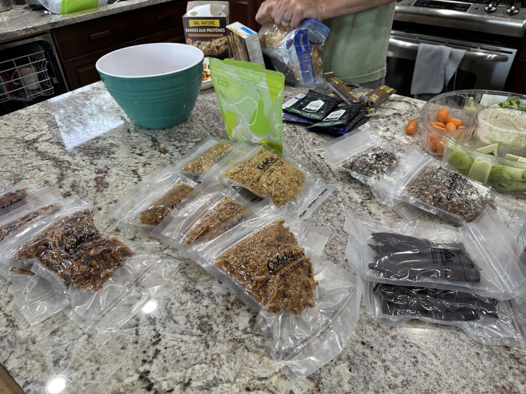 Bags of vacuum sealed dehydrated meals sit on island counter top.